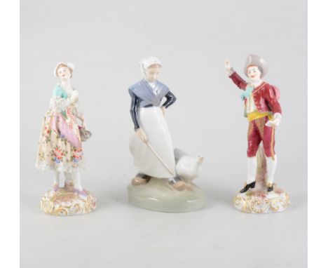 A pair of continental figures depicting a man and a woman, 18.5cm tall and a Royal Copenhagen Goose Girl figure, 18.5cm tall.