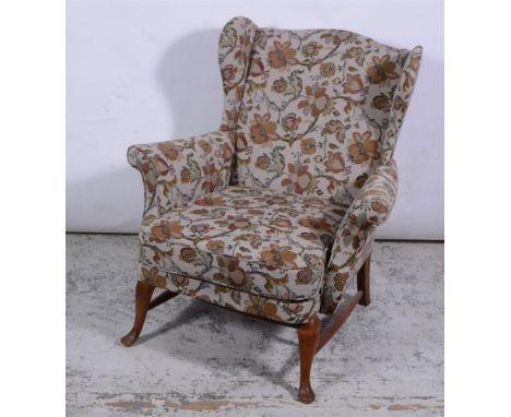 Victorian mahogany framed armchair, floral tapestry styled upholstery, shaped arms, carved and turned legs on castors, width 