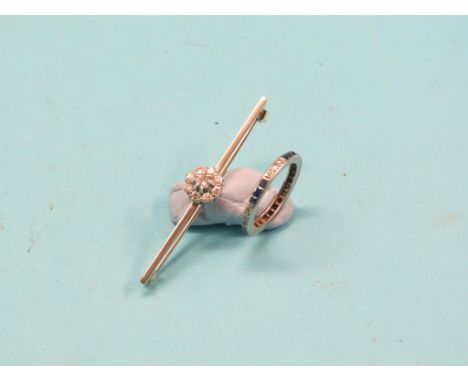 A diamond cluster bar brooch, and a sapphire and diamond chip eternity ring             