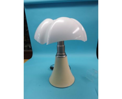 A contemporary Italian designer lamp, with opaque perspex shade, 28in. high, and a plastic model aircraft carrier, Challenger