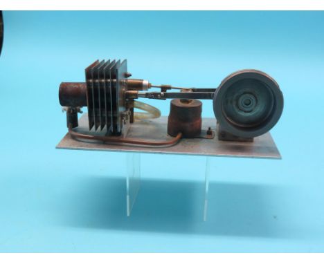A scratch-built hot air Sterling engine, single cylinder on aluminium base, 11in.