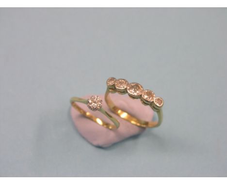 Two 18ct. gold and diamond rings, one five-stone half-hoop, the other claw-set solitaire, sizes R and L/M resp. 