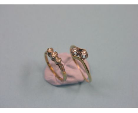 Two 18ct. gold and diamond rings, three-stone half-hoop, size K, two-stone old-cut crossover, size U/V 