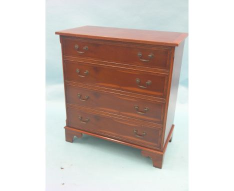 A reproduction yew-veneered chest, cross-banded top above four long drawers, bracket feet, 2ft. 9in.