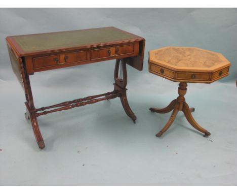 A reproduction faded yew octagonal table, cross-banded top with four frieze drawers, tripod base, 1ft. 11in., and a reproduct