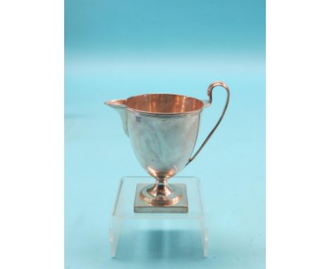 A George III silver milk jug, helmet-shape on square pedestal base, Henry Chawner, London 1791, approx. 6oz., 5in.