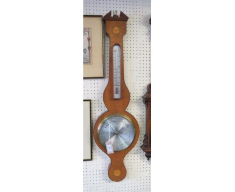 A Georgian-style mahogany wheel barometer, with silvered barometer and thermometer dials, inlaid bats-wing roundels, break-ar