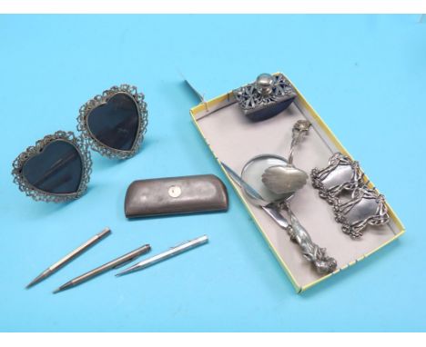 An engine-turned silver spectacles case, Birmingham 1936, a pair of late Victorian silver heart-shape photograph frames, Lond