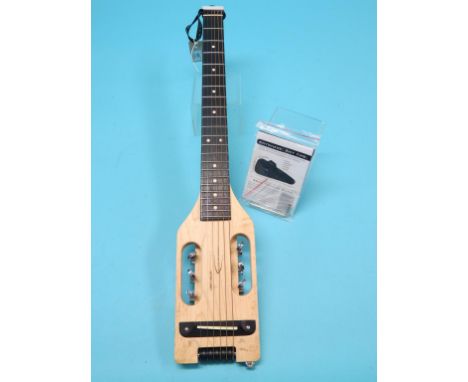 A left-handed Traveler Guitar, ultra-light model, six-stringed, in canvas case with manual, near-excellent