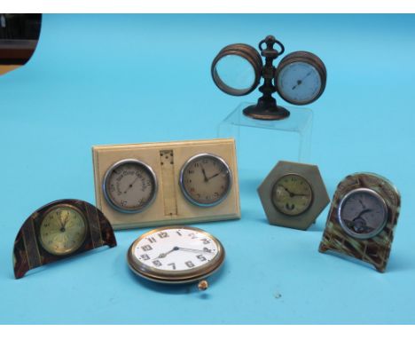 Two small tortoiseshell strut clocks, desk-top clock-barometer and three other items, as viewed