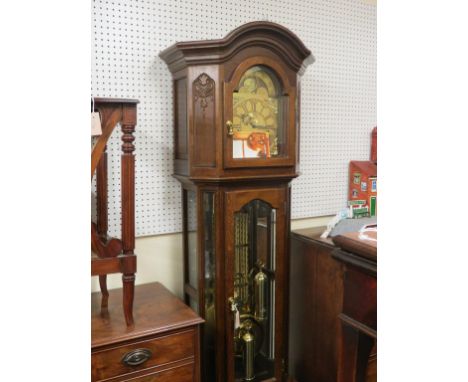 A modern period-style oak longcase clock, by Interclock, Belgium, arched brass dial with moon-phases and subsidiary seconds, 