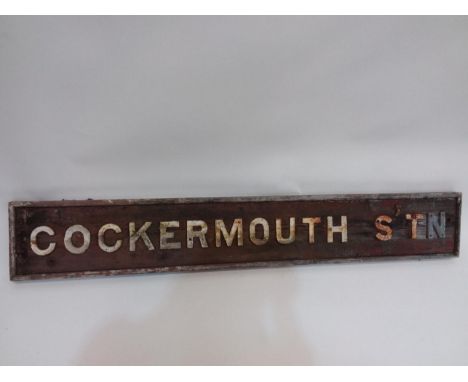 (cast letters on wooden back board)
