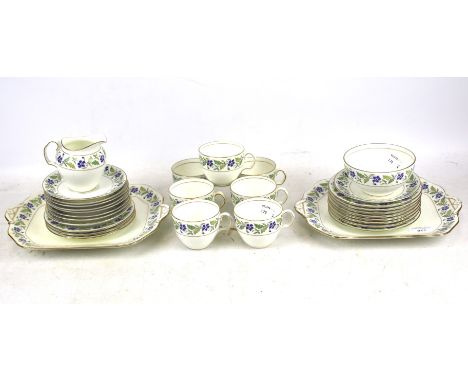 A Cauldron bone china tea service. A trio for seven people, two rectangular sandwich plates, a milk jug and sugar bowl, etc.