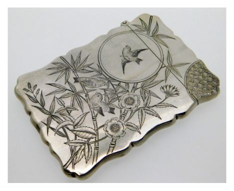 A decorative Victorian 1885 Birmingham silver card case by George Unite featuring birds &amp; foliates one side &amp; kingfis