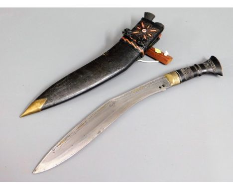 A kukri knife with leather scabbard, 17.125in long