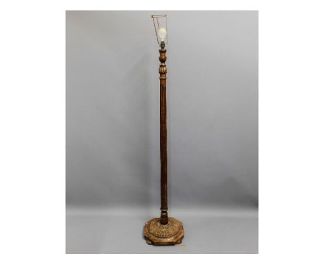 A decorative oak standard lamp 