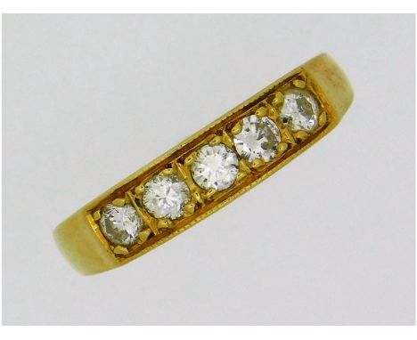 An 18ct gold five stone diamond ring of 0.32ct, 2.8g, size K