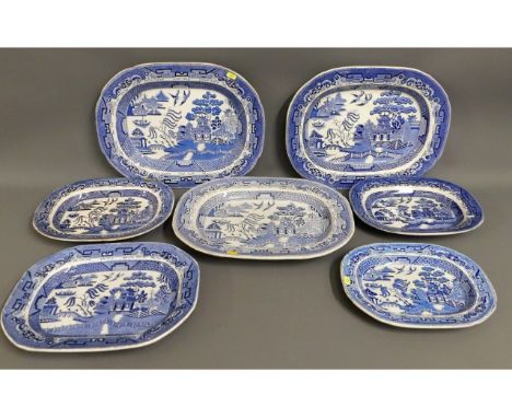 Seven antique &amp; 19thC. willow pattern blue &amp; white transferware meat dishes, inc. comb backs, largest 18in x 14.375in