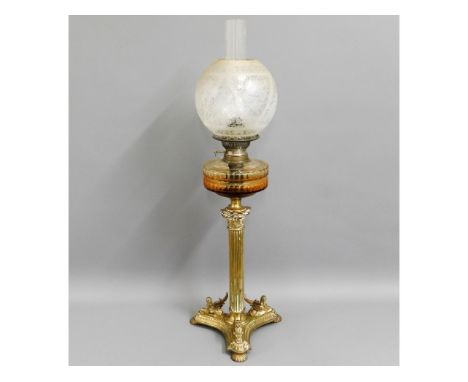 A Victorian brass oil lamp with three winged sphinx feet at base of Corinthian column &amp; decorative etched shade, 31.25in 