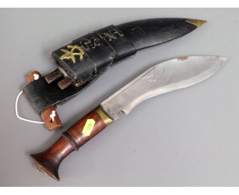 A Nepalese kukri knife with leather scabbard &amp; wooden handle, 16in long 