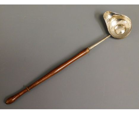 An 18/19thC. hardwood &amp; white metal toddy, tests as silver, 12.75in long, set with 1723 coin, 43.2g 