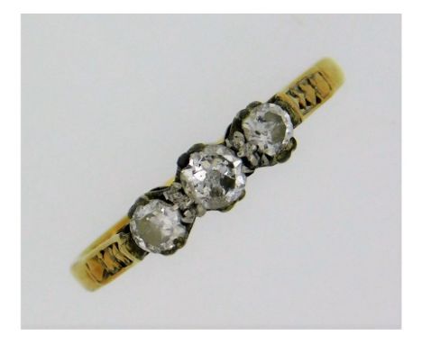 An antique 18ct three stone trilogy ring set with approx. 0.25ct diamonds, rubbed marks, 1.8g, size K