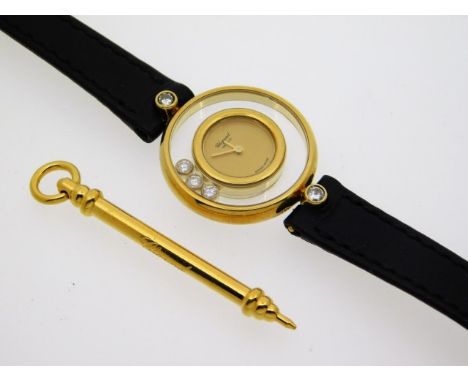 A ladies Chopard 18ct gold Happy Diamonds wrist watch with leather strap