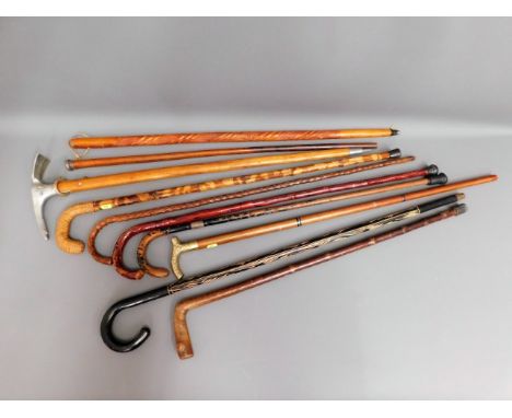 A quantity of ten walking sticks &amp; aids including a Rhonegletscher MT 2300 pick stick 