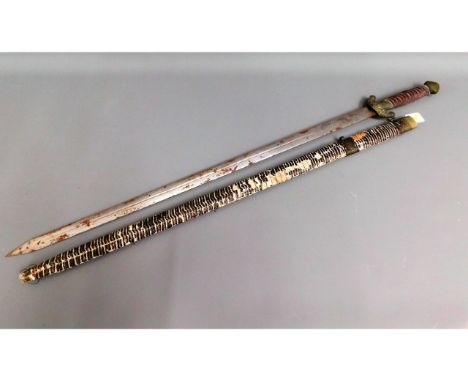 A Tibetan sword with scabbard, 39.75in long, a/f