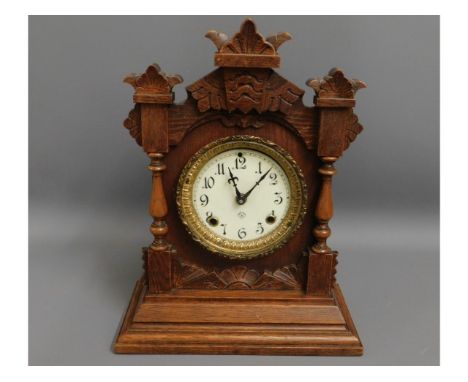 A gothic style Ansonia wooden mantel clock, 15in tall 