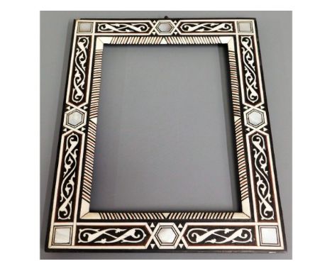 A mother of pearl inlaid Islamic frame, 13in x 7in 