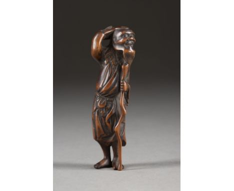 EIN HOLZGESCHNITZTES NETUSKE DES TEKKAI SENNIN Japan, 18./19. Jahrhundert Holz. H. 9 cm. Das Netsuke ist als Tekkai Sennin ge