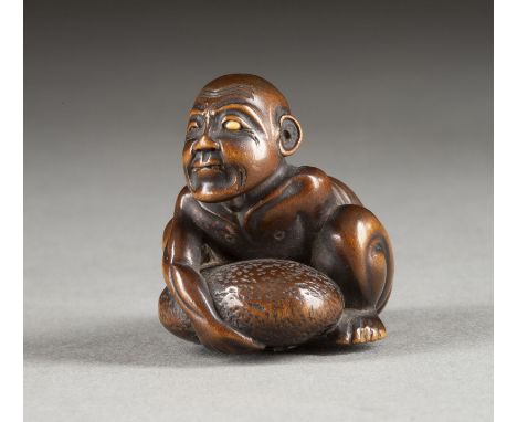 EIN FEINES HOLZGESCHNITZTES NETSUKE EINES BLINDEN BETTLERS Japan, 19. Jahrhundert Holz. H. 3.9 cm. Das Netsuke ist als ein bl