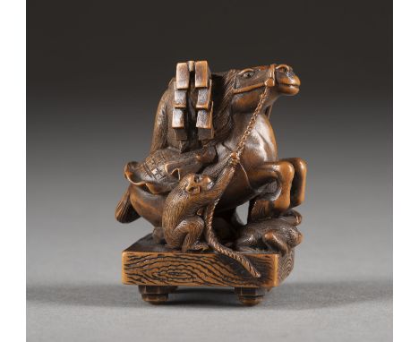 EIN FEINES HOLZGESCHNITZTES NETUSKE DER GRUPPE VON AFFEN UND PFERD Japan, 19. Jahrhundert Holz. H. 4.8 cm. Das Netsuke stellt