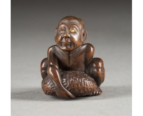 EIN HOLZGESCHNITZTES NETSUKE EINES BLINDEN BETTLERS Japan, 19. Jahrhundert Holz. H. 3.7 cm. Das Netsuke ist als ein blinder B