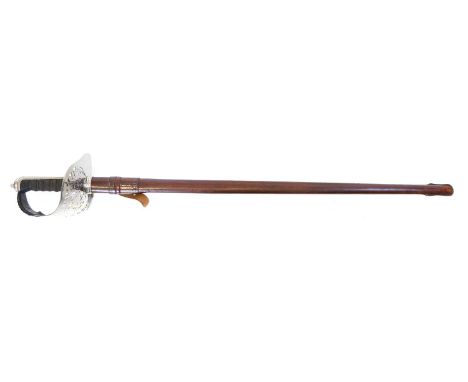 1897 pattern Wilkinson Royal Army of Oman Officers sword and scabbard, the etched blade with Oman crests either side, stamped
