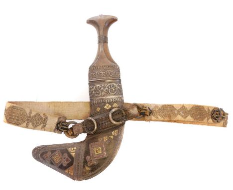 Oman Jambiya or khanjar, embossed white metal mounts, the leather scabbard braided with brass and copper decoration, with sus