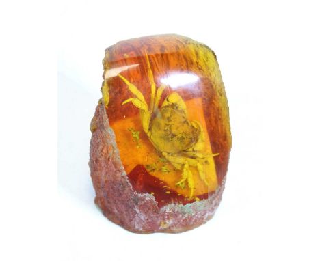 A faux amber boulder with inset crab, h.9cm 