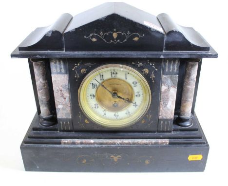 A Victorian black slate and rouge marble mantel clock, of architectural form, the enamel chapter ring showing Arabic numerals