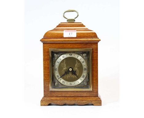 A 20th century mahogany cased mantel clock, in the 18th century style, the silvered chapter ring showing Roman numerals, with