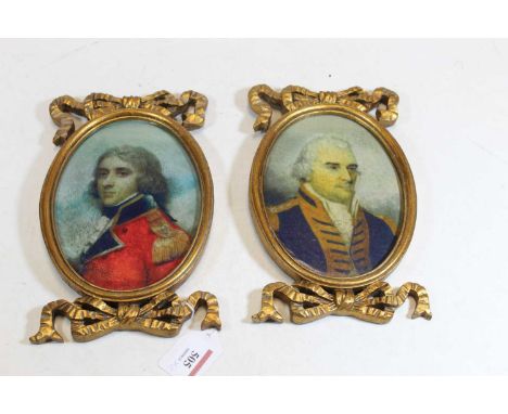 A pair of reproduction portrait prints of military officers within gilt frames surmounted by bows