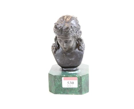 A modern bronzed portrait bust of a lady, on a green faux marble base, h.15.5cm 