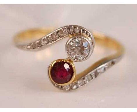 A vintage 18ct gold, ruby and diamond crossover ring, the round cut diamond weighing approx 0.15 carats. the shoulders furthe