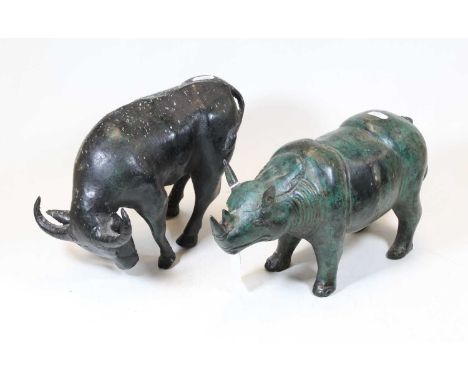 A 20th century cast verdigris metal model of a rhinoceros, h.17cm ; together with another similar of a buffalo (2)