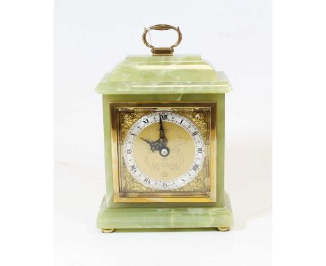 A 20th century onyx mantel clock, in the 18th century style, the silvered chapter ring showing Roman numerals, with mask span