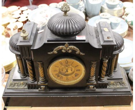 A Victorian black slate eight-day mantel clock, of architectural form, the gilt chapter ring showing Roman numerals, with vis