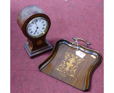 An Edwardian mahogany and boxwood strung balloon shaped mantel clock having an enamel dial with Roman numerals and cylinder m