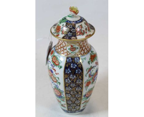 A First Period Worcester vase and cover, the cover with restored flower finial, the body decorated with panels of flowers in 