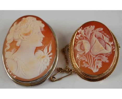 A modern carved shell cameo brooch, depicting a floral posy in 9ct gold mount, 30 x 22mm; together with a portrait cameo broo