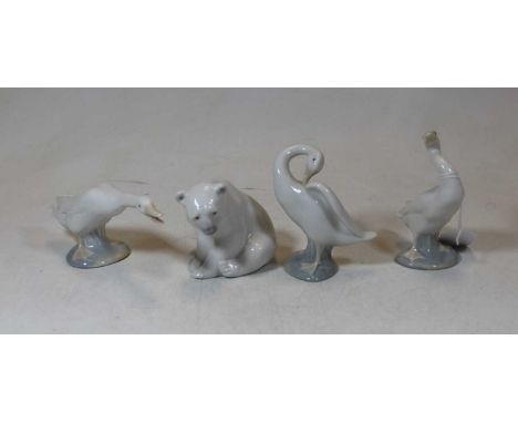 A Lladro Spanish porcelain model of a polar bear cub in seated pose having printed mark verso, impressed B10, height 8.5cm, t